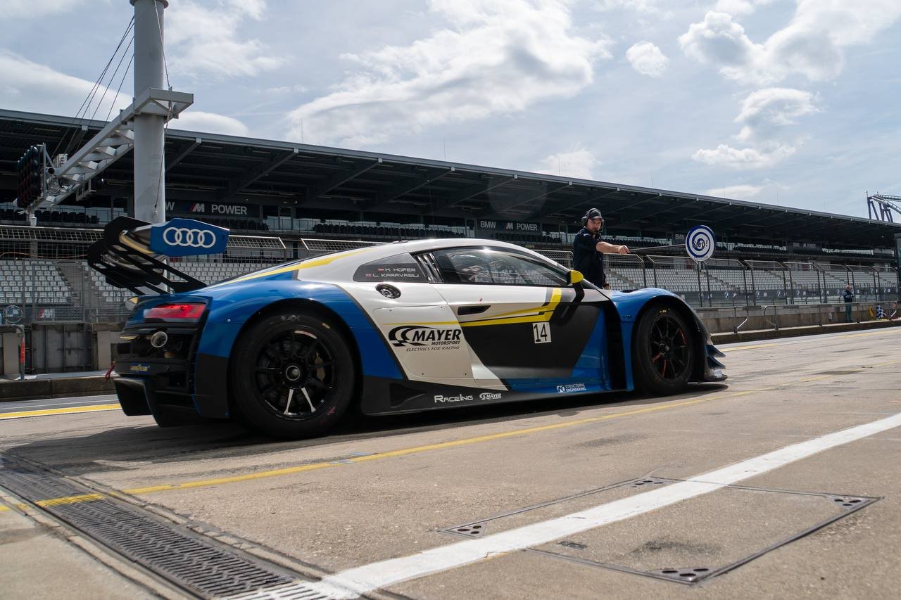 Audi R8 LMS GT3 in front of the grandstand